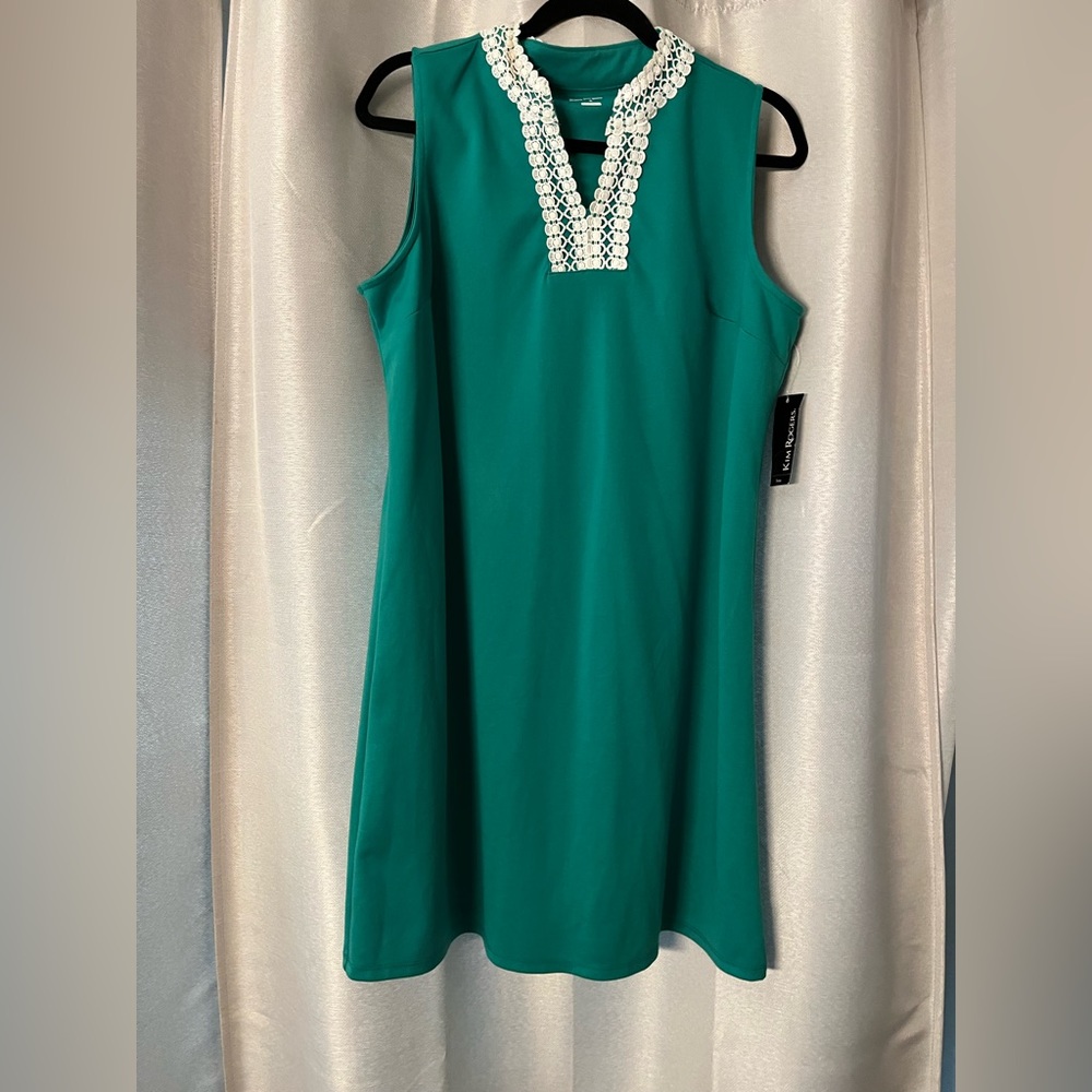 Kim Rogers sleeveless green with white trim.